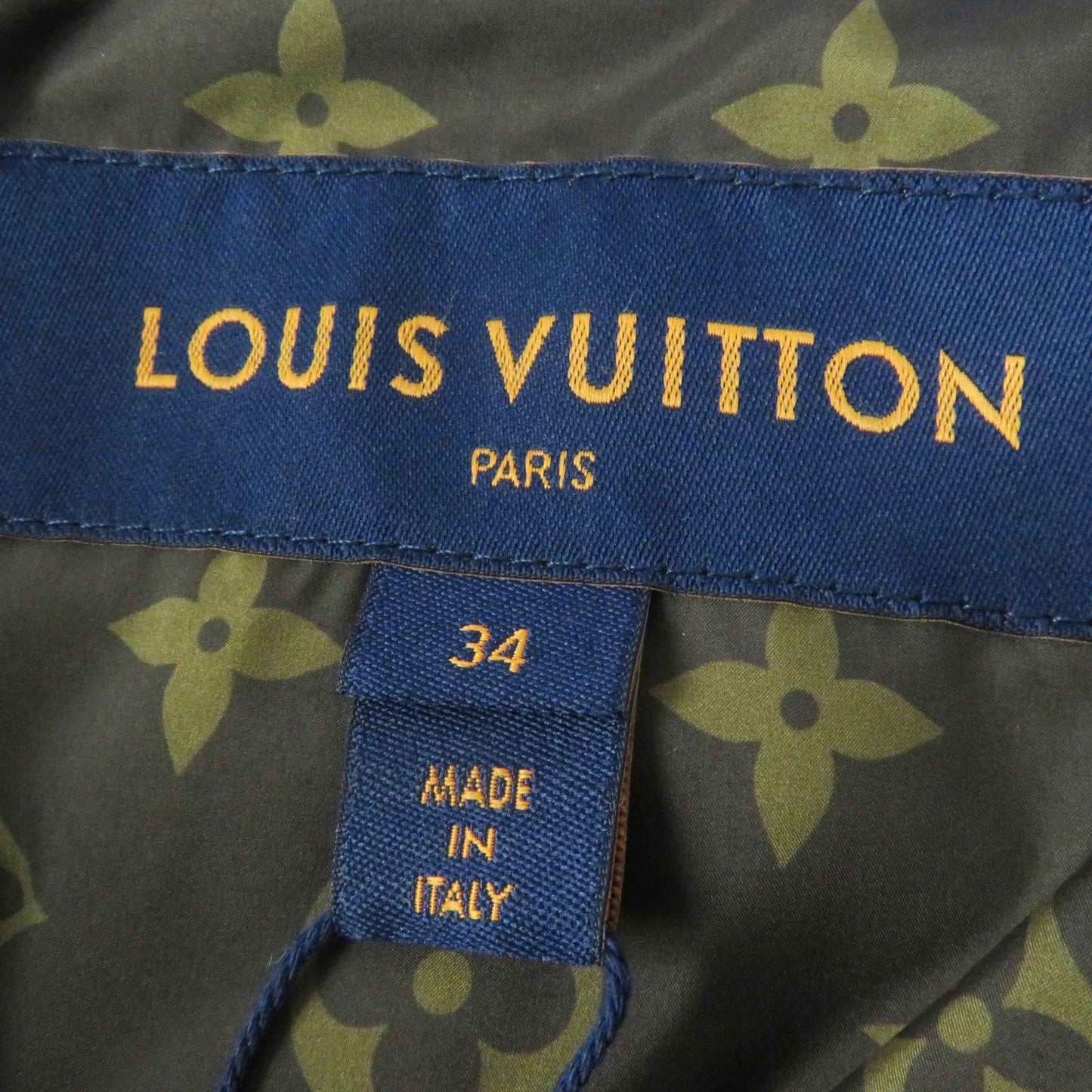 LOUIS VUITTON Down jacket Outer: 71% nylon, Outer: 29% polyester, Lining: 50% polyester, Lining: 50% cotton, Filling: 90% down, Belt: 100% cotton, Sheepskin blue Women 34