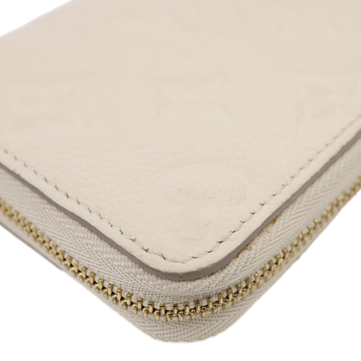 LOUIS VUITTON Zippy Coin Purse Monogram Empreinte Leather Pouch Off White
