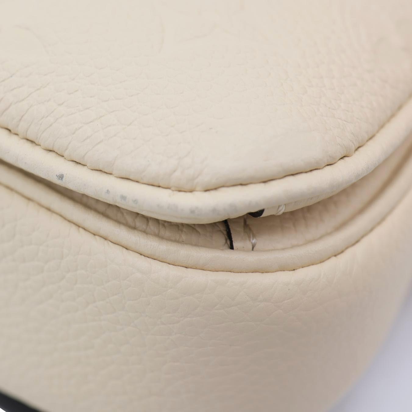 LOUIS VUITTON Metis East West Pochette Empreinte Leather Crossbody Bag Cream