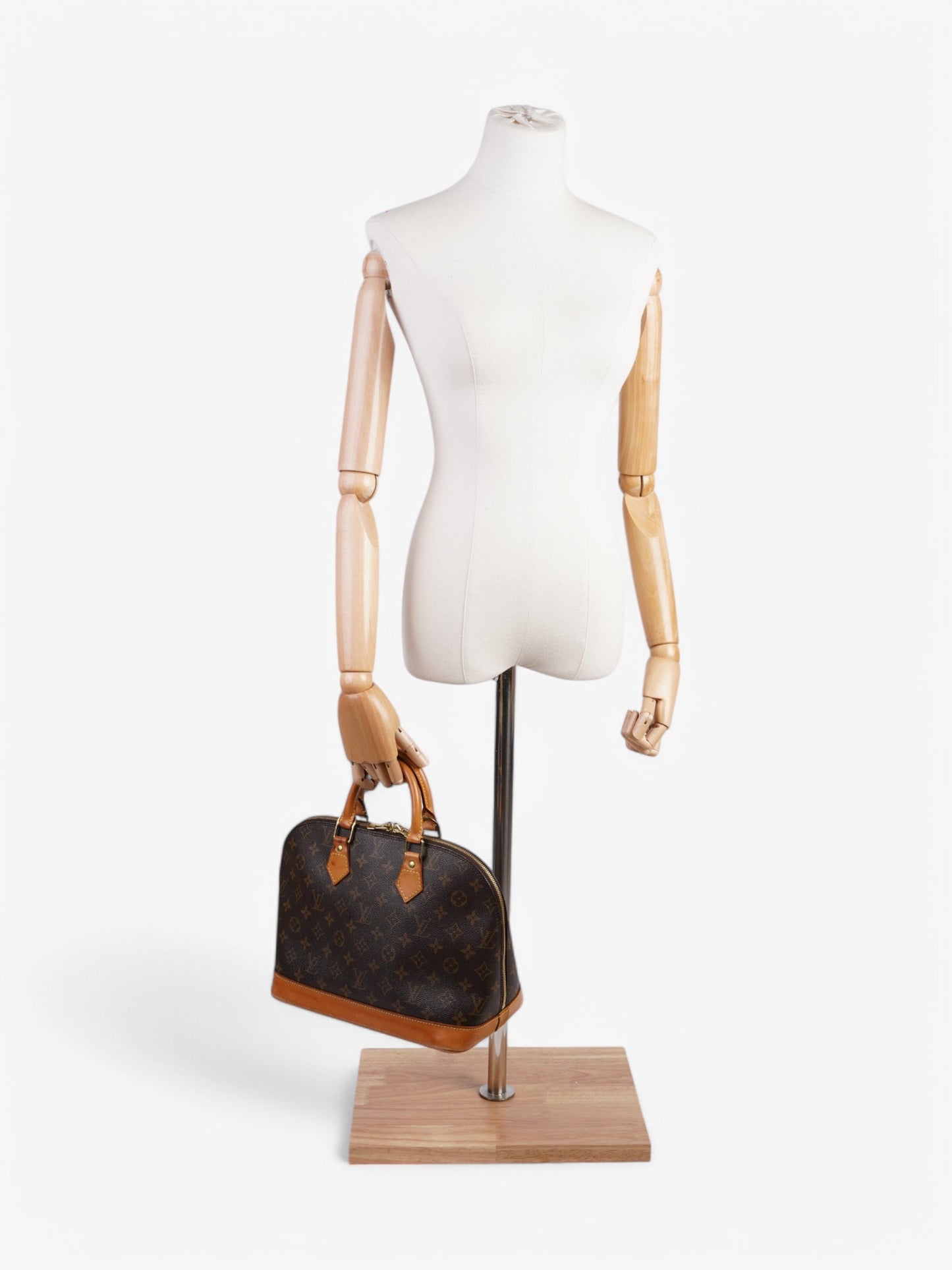 Louis Vuitton Alma Monogram Coated Canvas PM