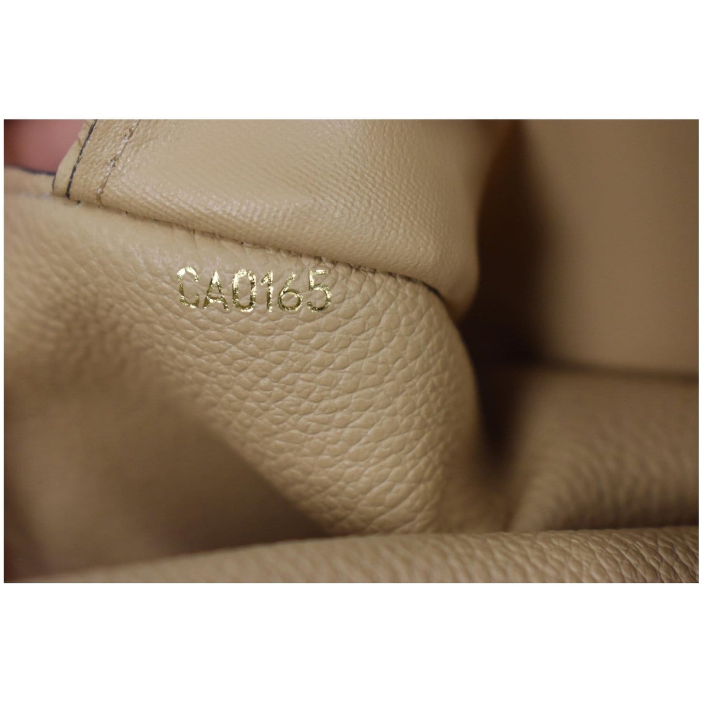 LOUIS VUITTON Curieuse Monogram Empreinte Leather Wallet Bronze
