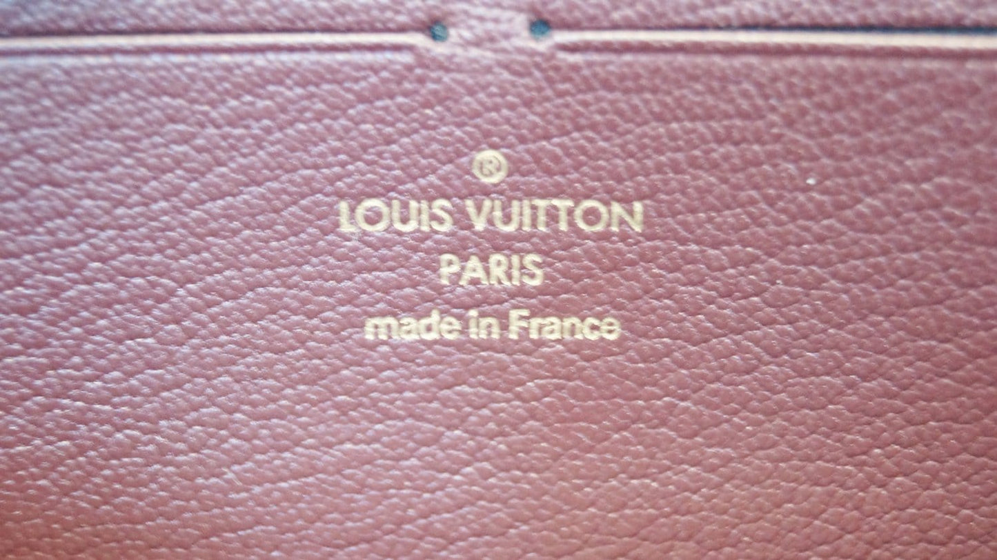 LOUIS VUITTON Burgundy Ostrich Leather Zippy Wallet - Sale