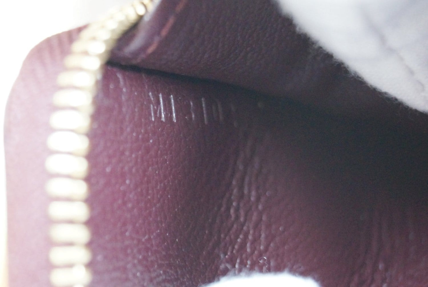 LOUIS VUITTON Burgundy Ostrich Leather Zippy Wallet - Sale
