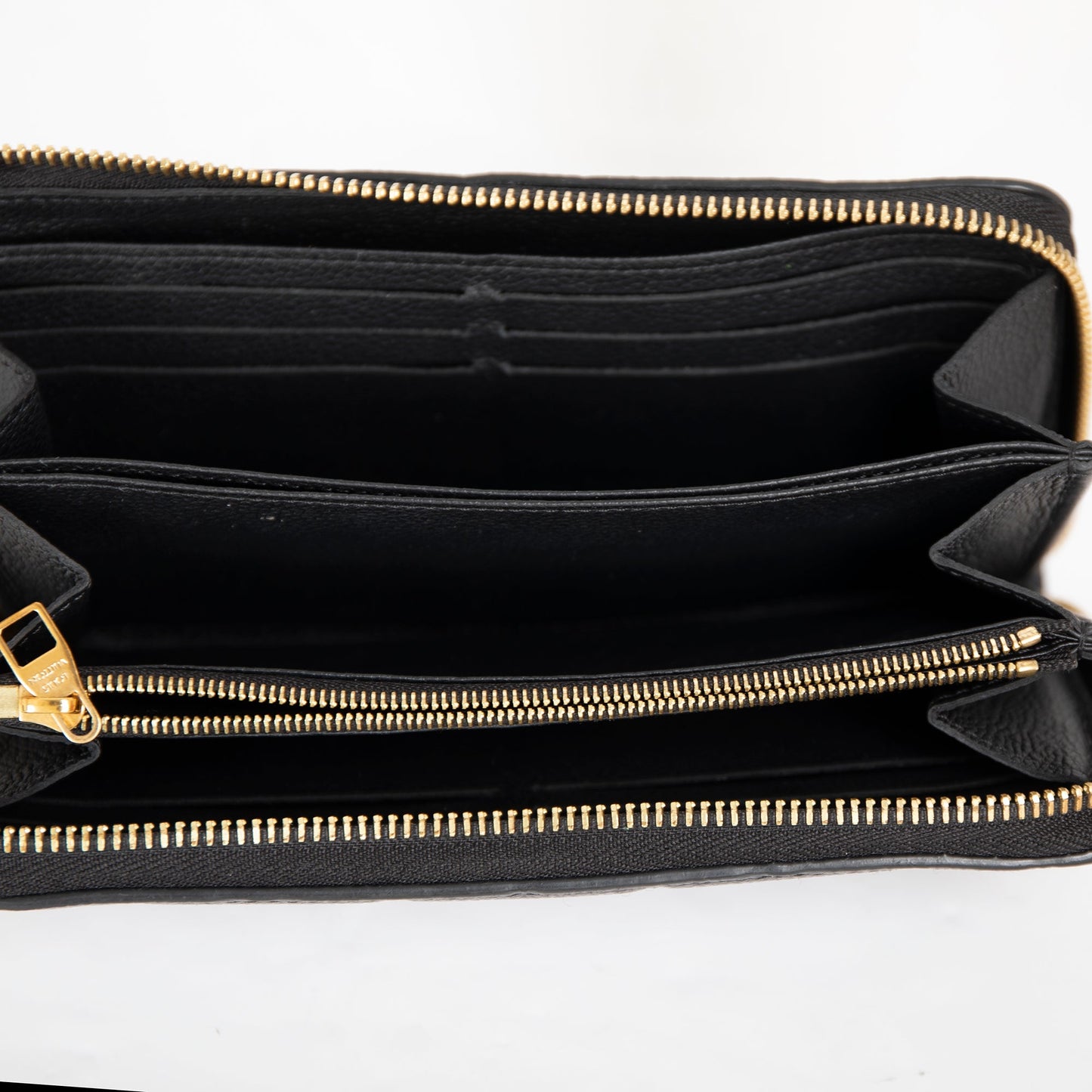 Louis Vuitton Monogram Empreinte Leather Zippy Wallet