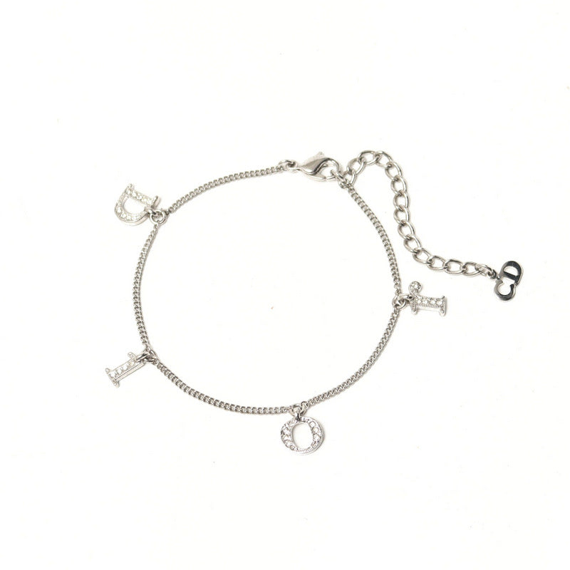 Christian Dior bracelet Gold Plated, Crystal Stone Silver Logo charm Women