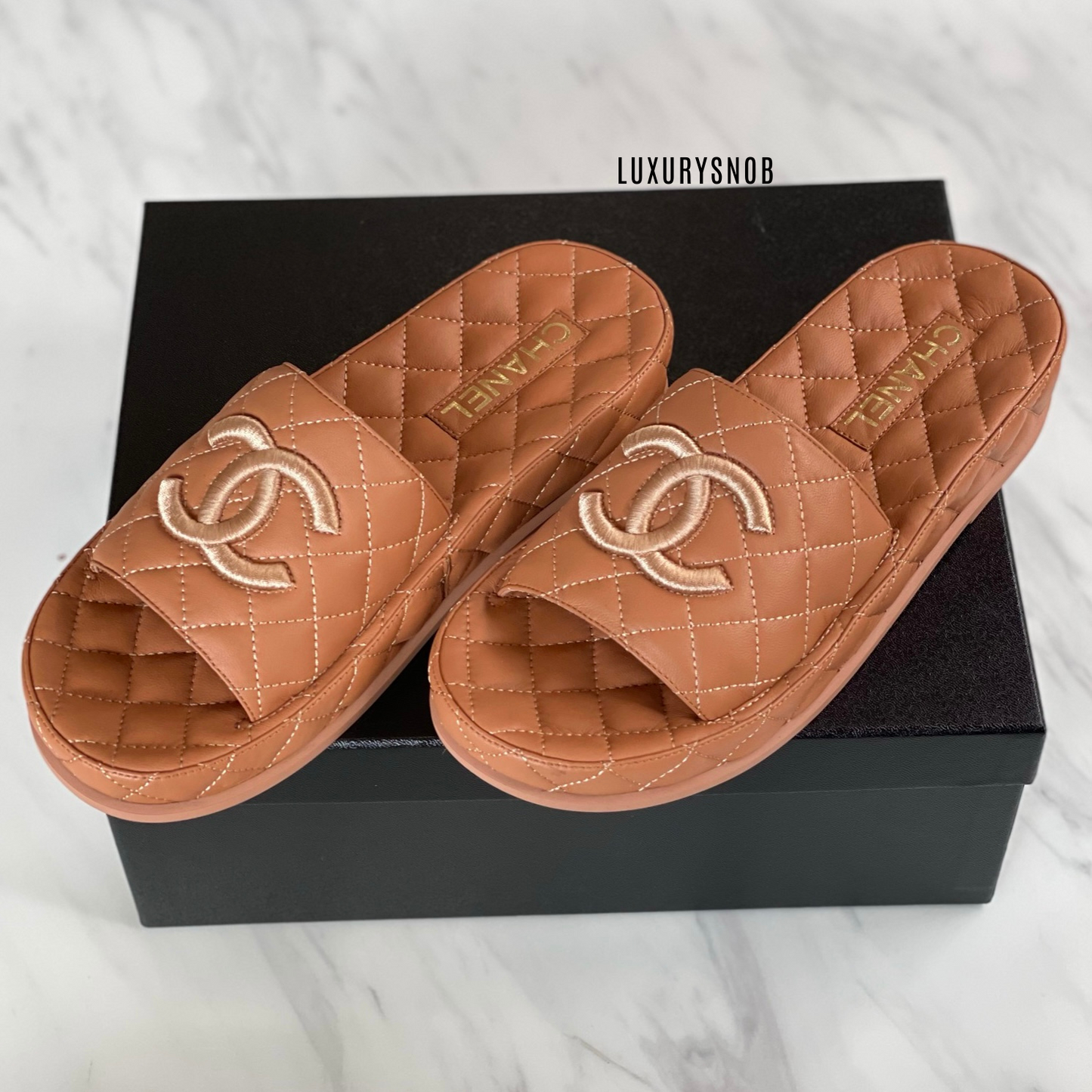 Chanel CC quilted slides